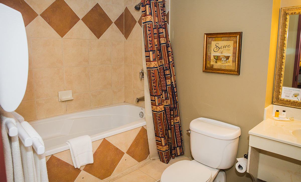 King Bathroom, with towel warmer and air-massage tub.